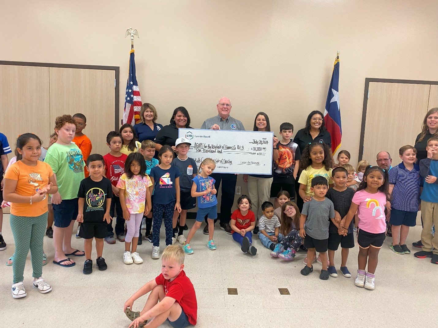 Harris County Commissioner Tom Ramsey joins in as kids participate in a fun moment during the final P3 Kids event and check presentation.